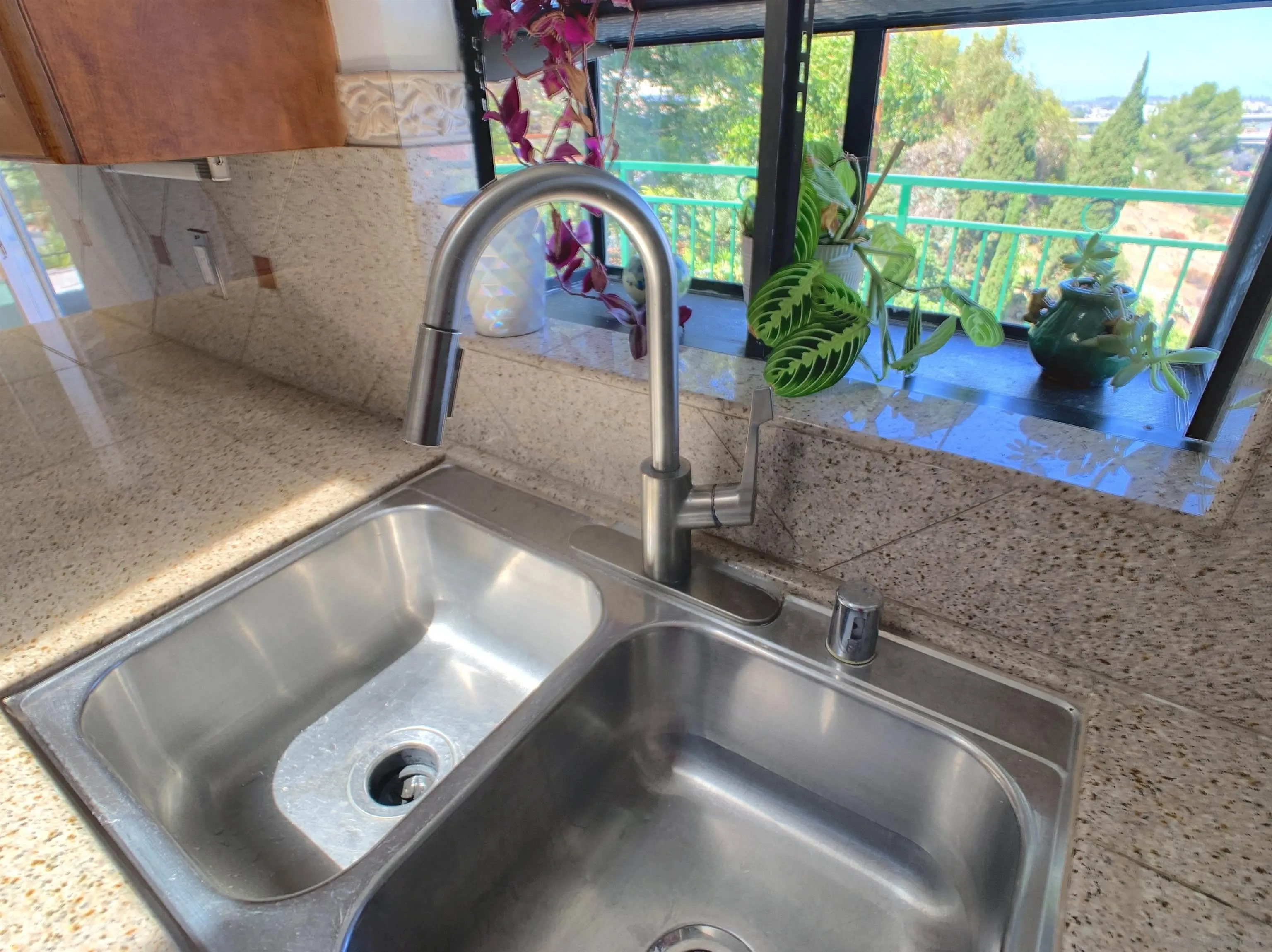 3606 Hartzel Drive Spring Valley, CA 91977 - Photo 38 of 75 Stainless steel double-sided sink with atrium window.