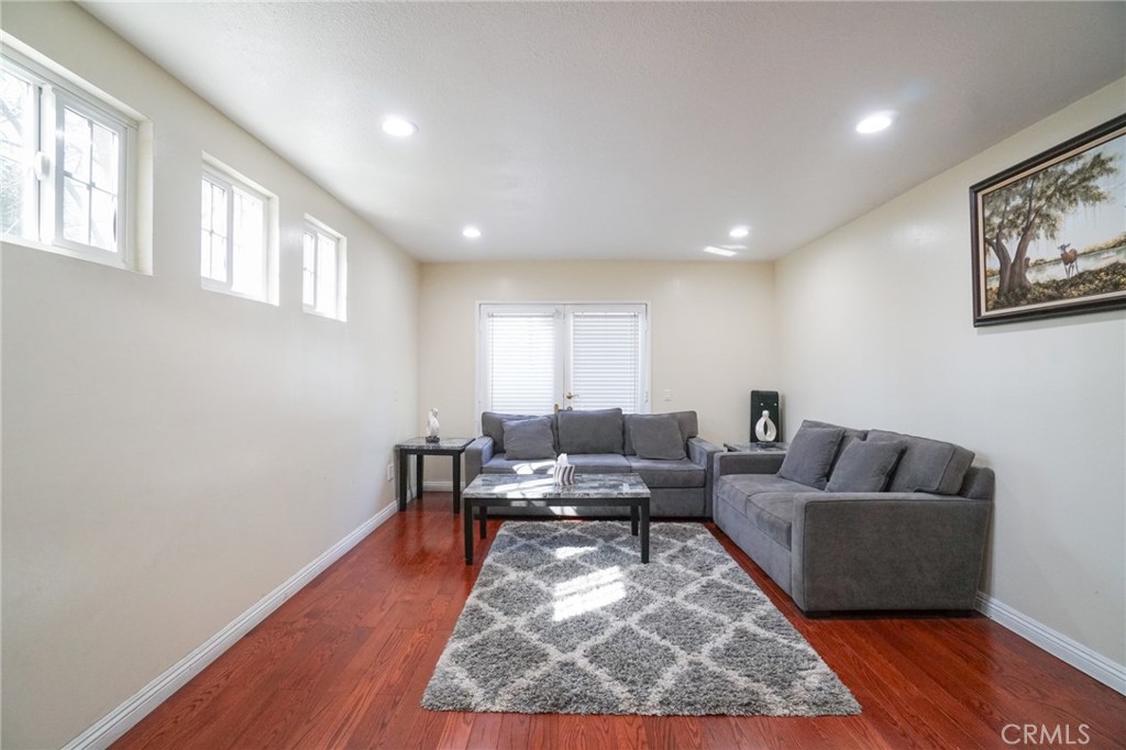 19259 Kenya Street Porter Ranch, CA 91326 - Photo 11 of 31 a living room with furniture and a rug