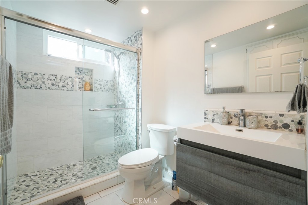 19259 Kenya Street Porter Ranch, CA 91326 - Photo 12 of 31 a bathroom with a sink a toilet and shower