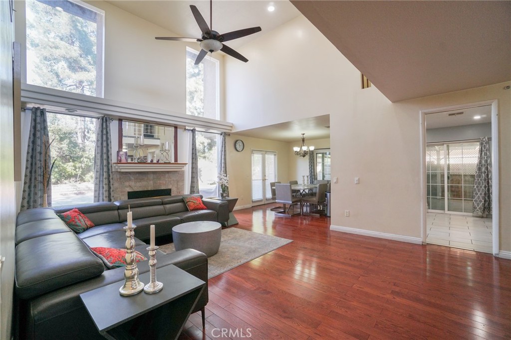 19259 Kenya Street Porter Ranch, CA 91326 - Photo 13 of 31 a living room with furniture a fireplace and a window