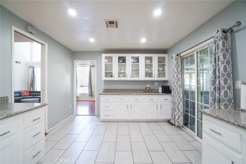 19259 Kenya Street Porter Ranch, CA 91326 - Photo 14 of 31 a kitchen with a sink stove and cabinets