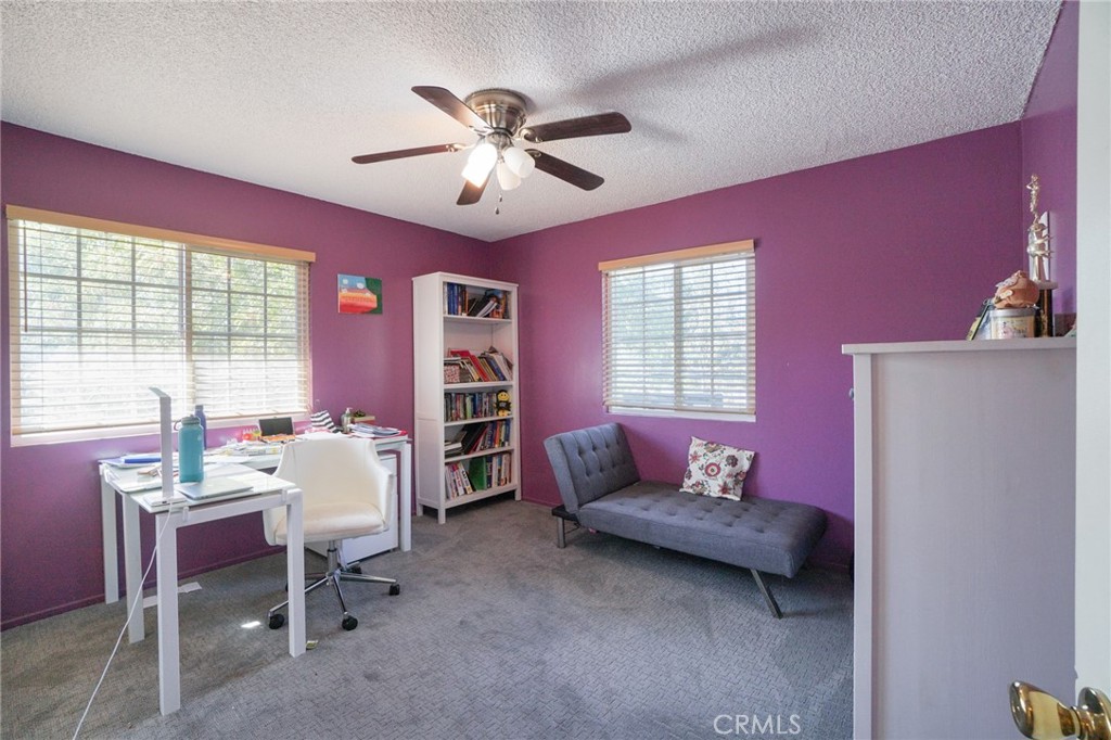 19259 Kenya Street Porter Ranch, CA 91326 - Photo 21 of 31 a living room with furniture and a window