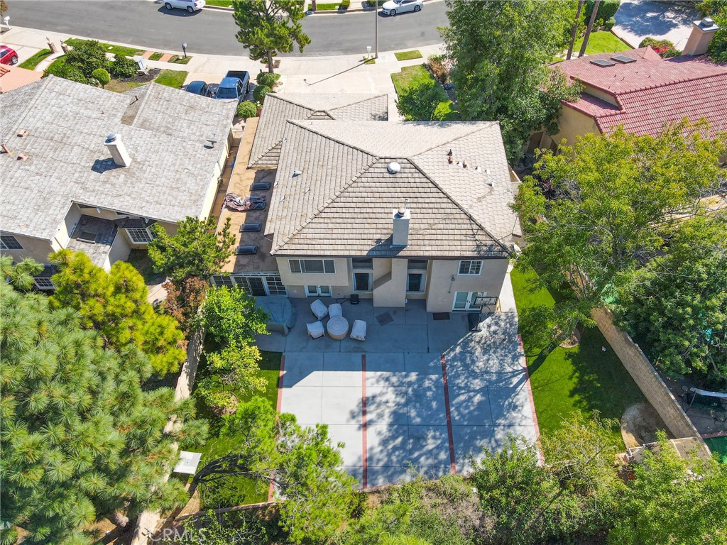 19259 Kenya Street Porter Ranch, CA 91326 - Photo 3 of 31 an aerial view of a house with yard and swimming pool