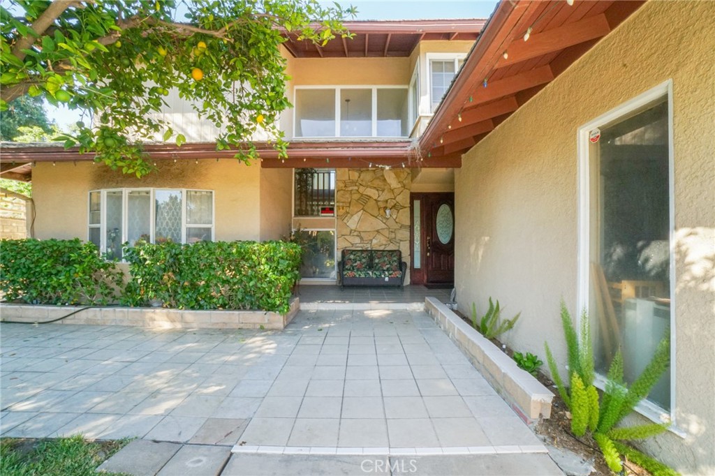 19259 Kenya Street Porter Ranch, CA 91326 - Photo 8 of 31 a front view of a house with a yard