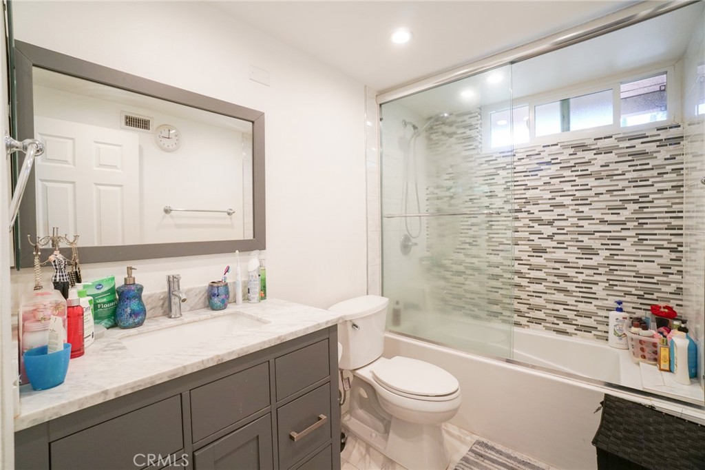 19259 Kenya Street Porter Ranch, CA 91326 - Photo 9 of 31 a bathroom with a sink a toilet and shower
