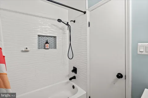 a bathroom with a shower and a shower