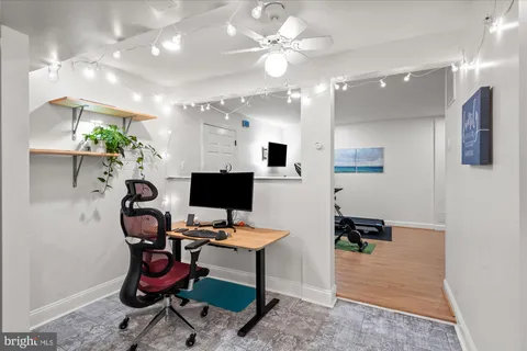 a view of a workspace with furniture