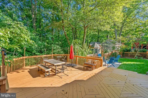 a view of a wooden deck and city view