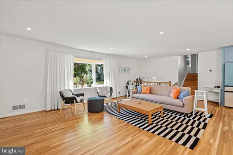 a living room with furniture or window and a wooden floor
