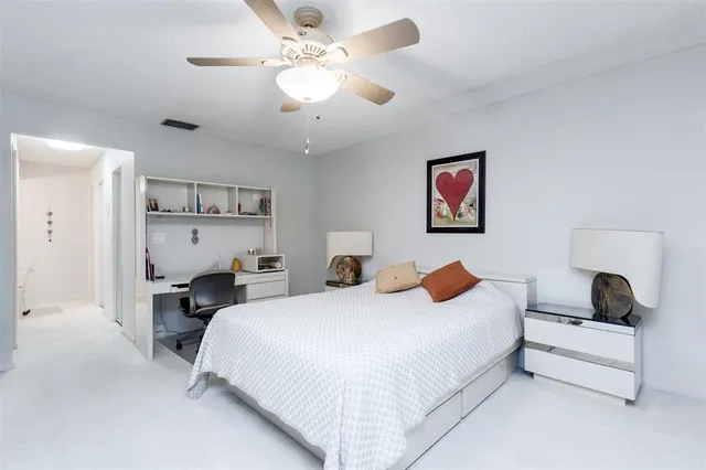 a view of a room with a table and chairs