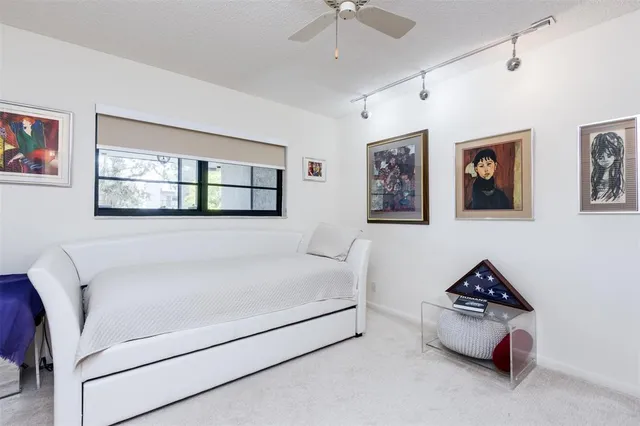 a living room with furniture and white walls