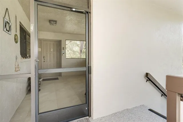 a view of a room with window and stairs