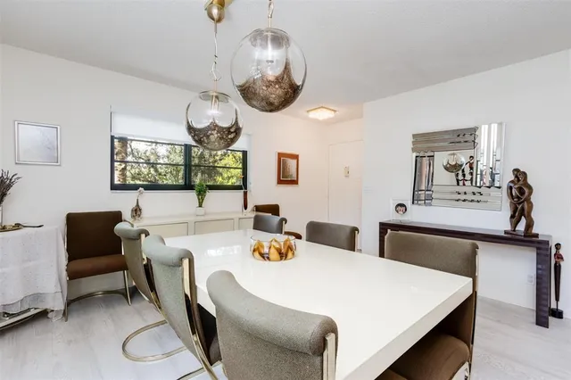 a kitchen with granite countertop a sink and cabinets