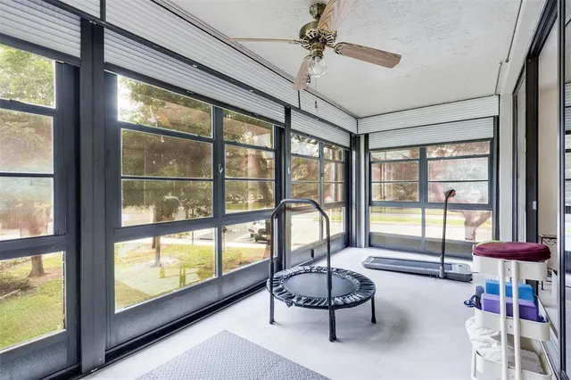 a view of a dining room with furniture a rug and wooden floor