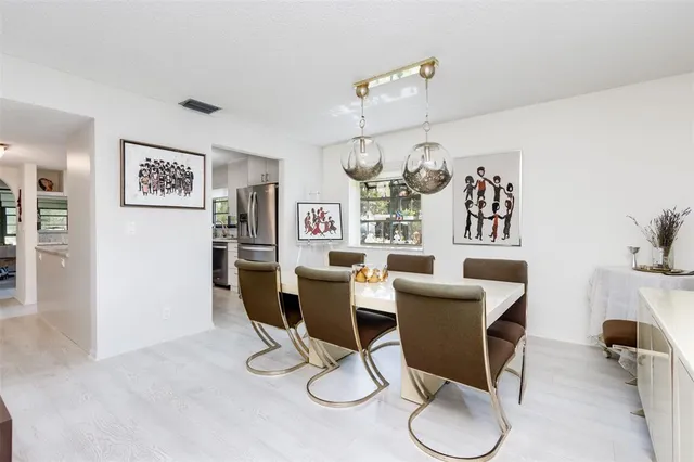 a living room with furniture and floor to ceiling window