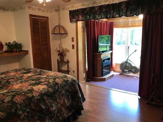 2131 Evergreen Road Covington, VA 24426 - Photo 31 of 56 1st floor bedroom open to sunroom