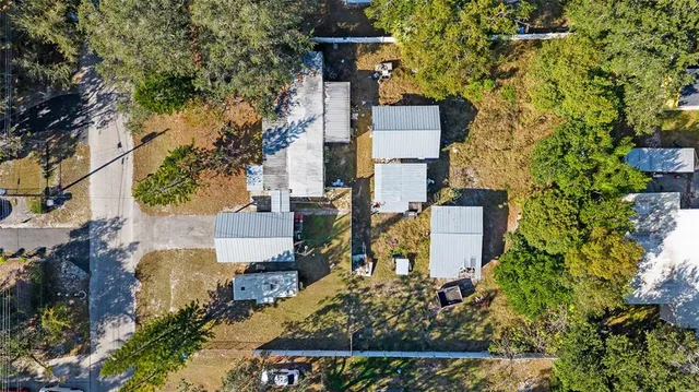an aerial view of houses with outdoor space