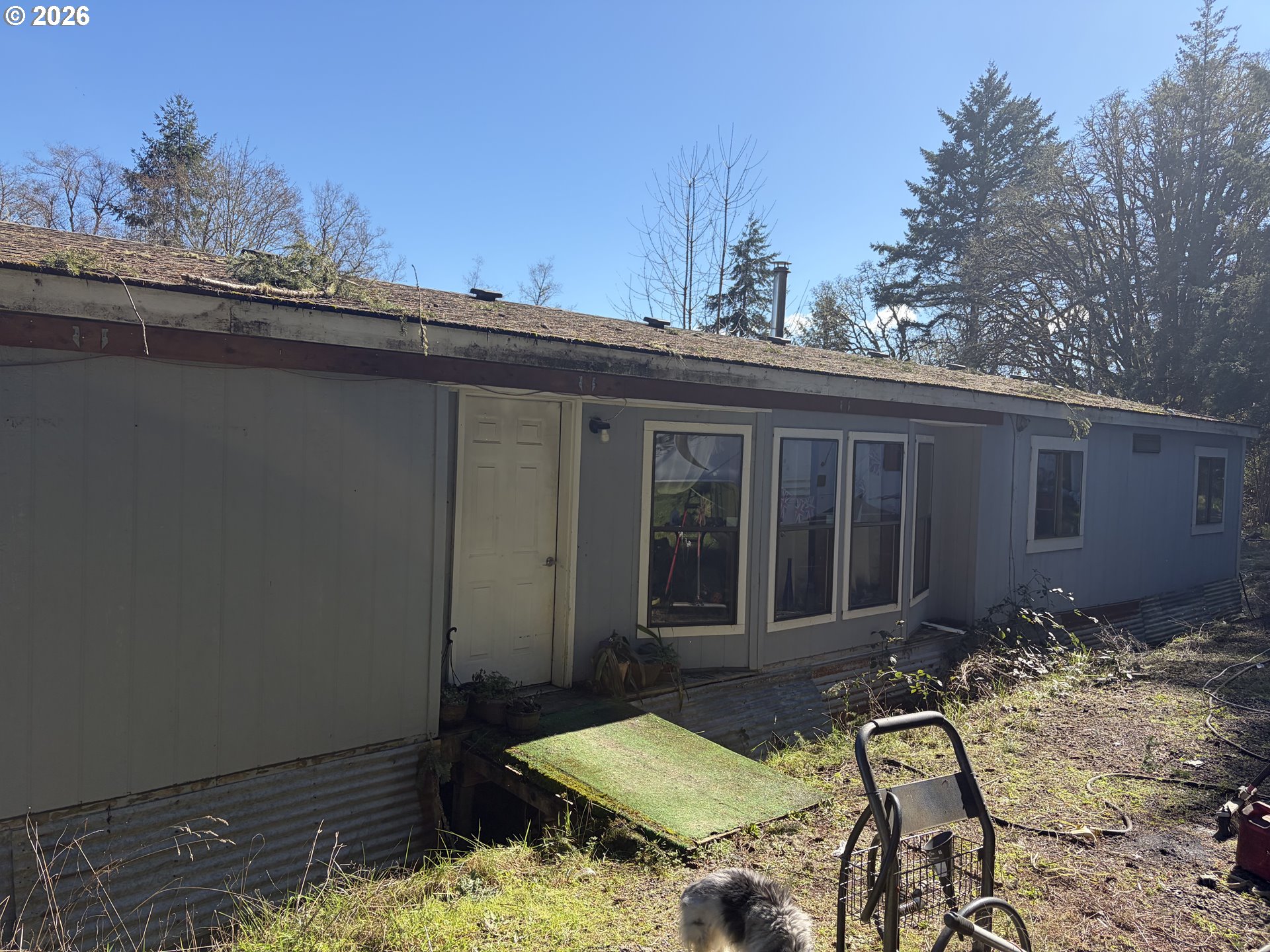 24710 Judy Lane Monroe, OR 97456 - Photo 2 of 14 a view of a chair and table in backyard