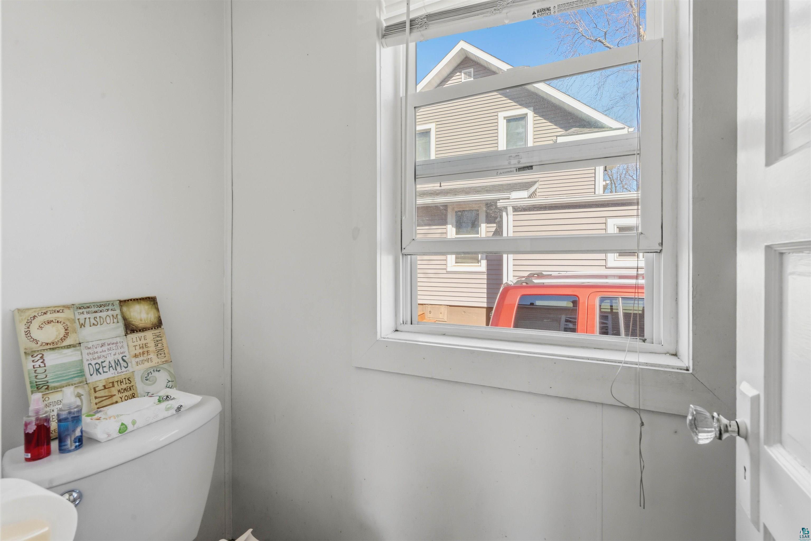 809 Prospect Avenue Cloquet, MN 55720 - Photo 14 of 20 Half bath with plenty of natural light