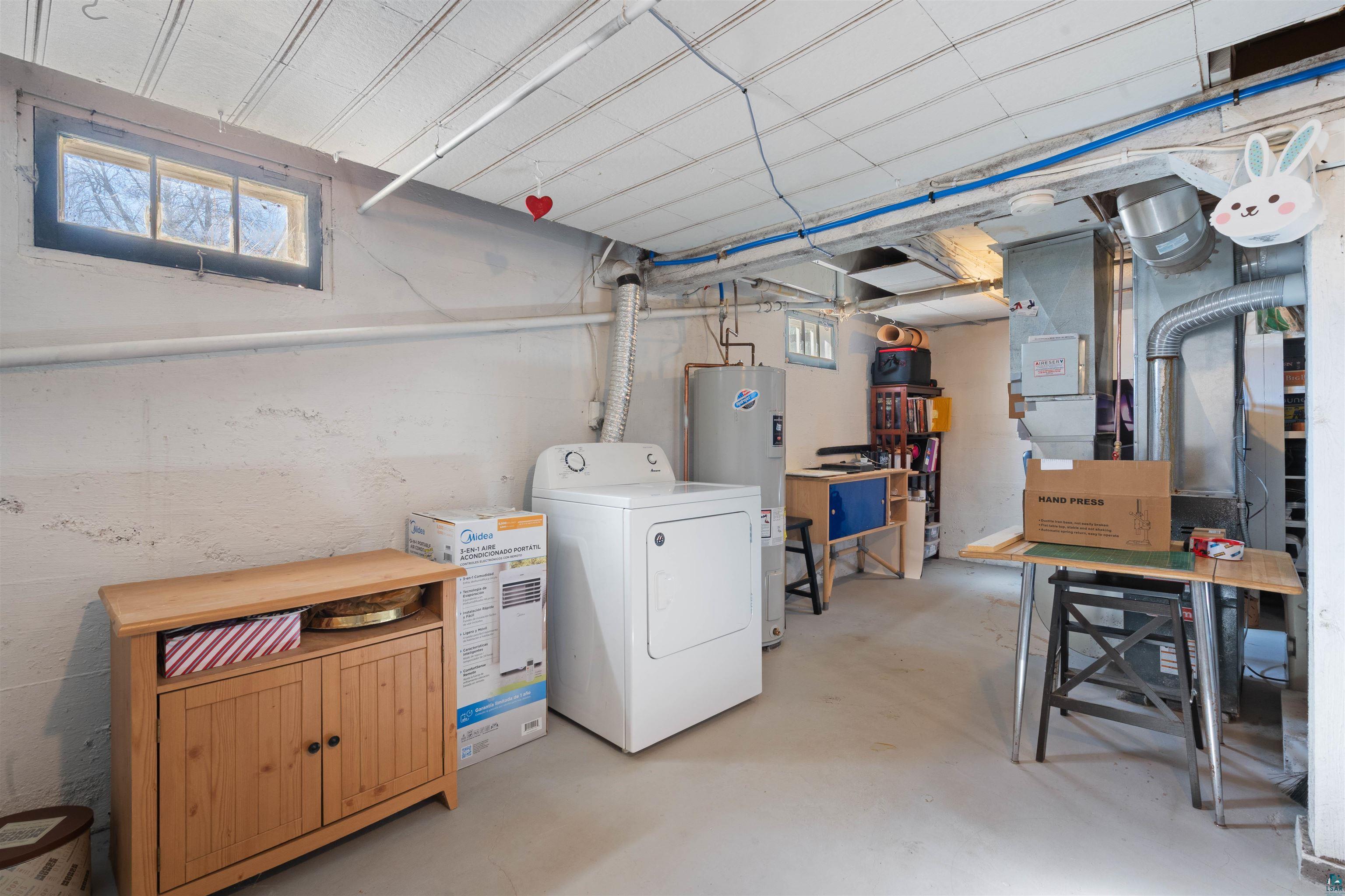 809 Prospect Avenue Cloquet, MN 55720 - Photo 17 of 20 Basement featuring washer / clothes dryer and water heater