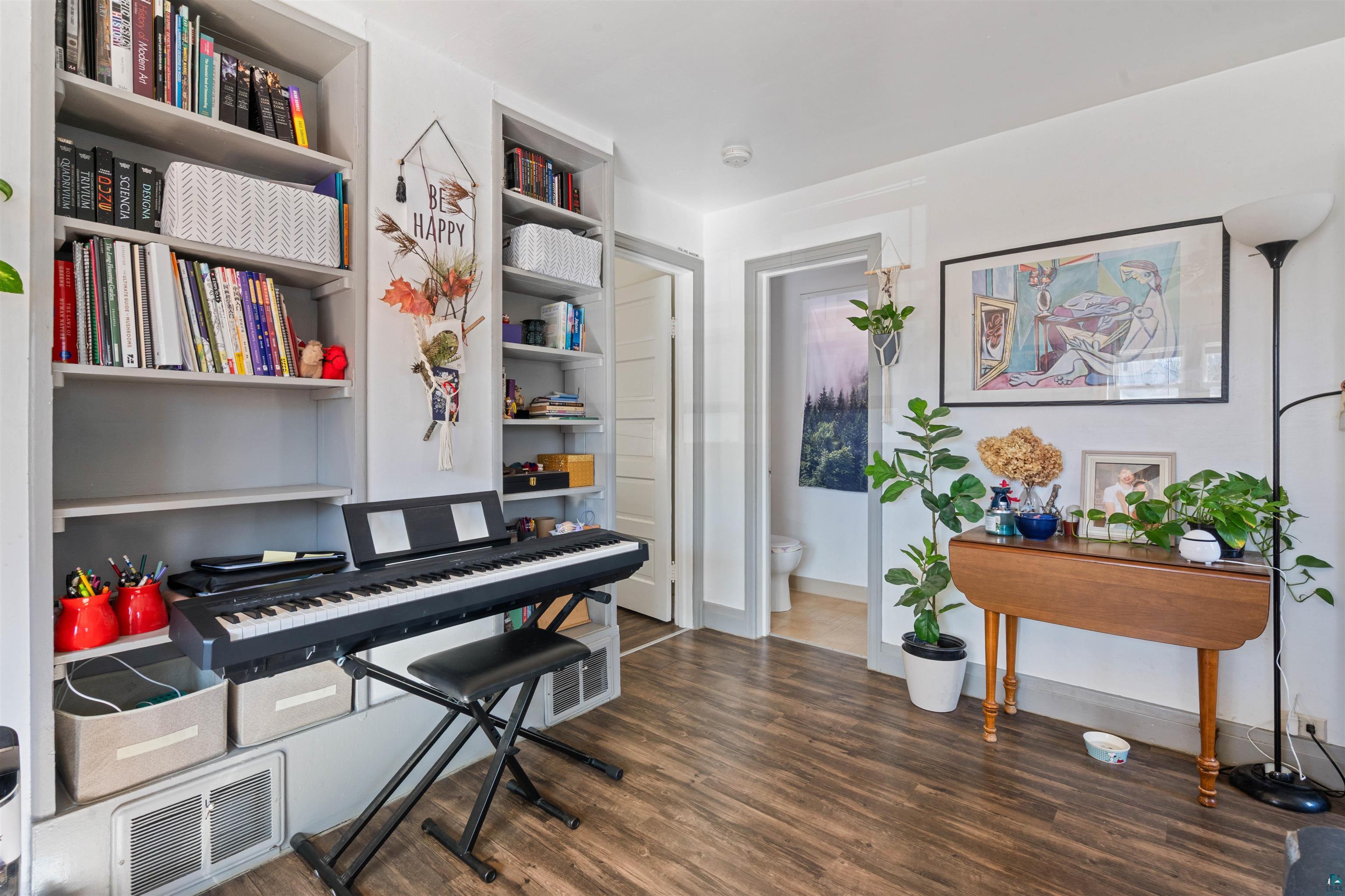 809 Prospect Avenue Cloquet, MN 55720 - Photo 8 of 20 Sitting room with dark wood-style floors and baseboards