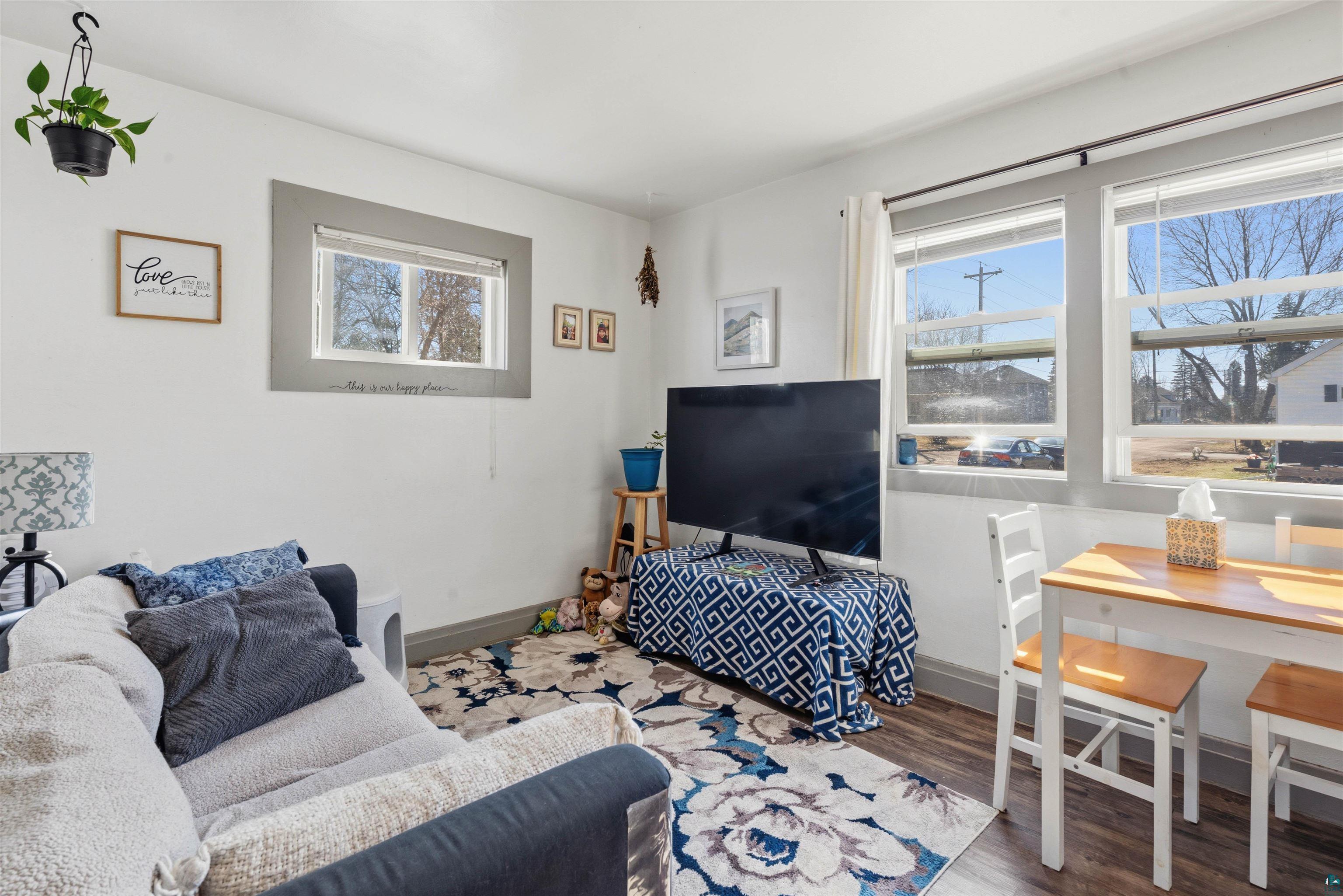 809 Prospect Avenue Cloquet, MN 55720 - Photo 9 of 20 Living area with dark wood-type flooring and baseboards