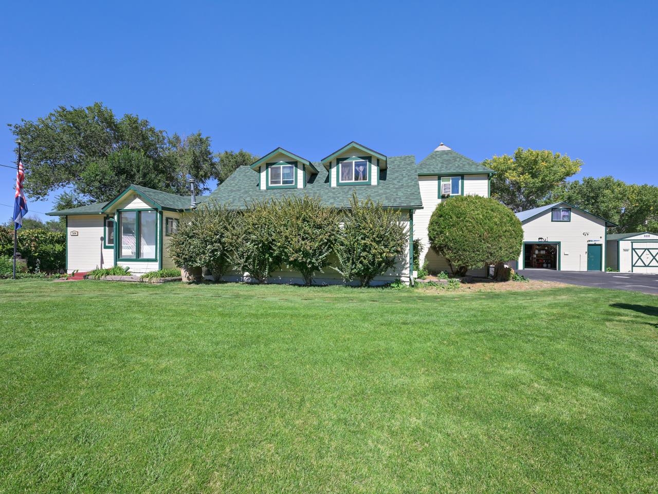 3694 F Road Palisade, CO 81526 - Photo 2 of 42 a front view of a house with garden
