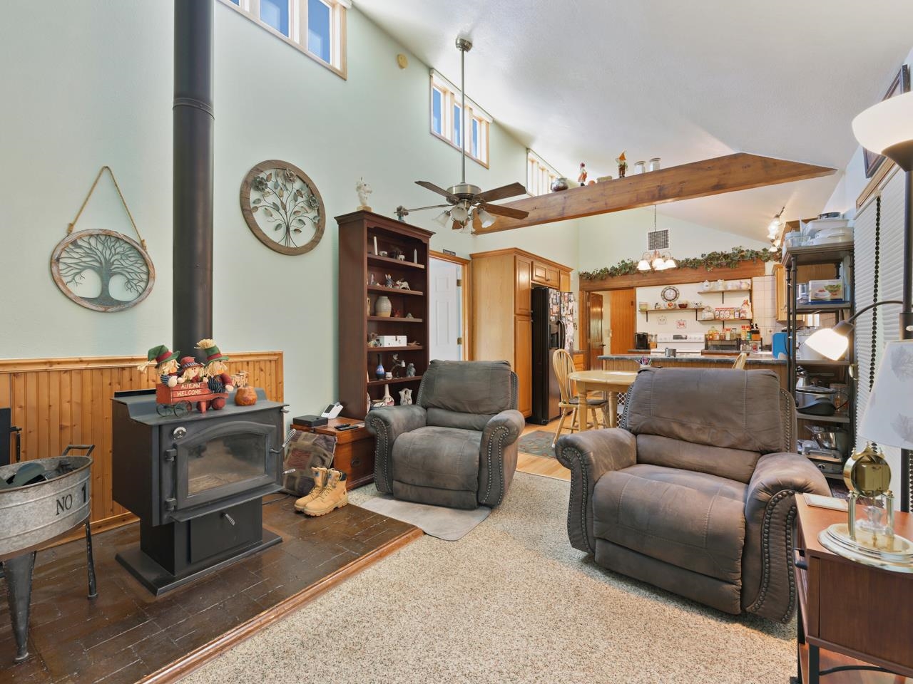 3694 F Road Palisade, CO 81526 - Photo 26 of 42 a living room with furniture a clock and a fireplace