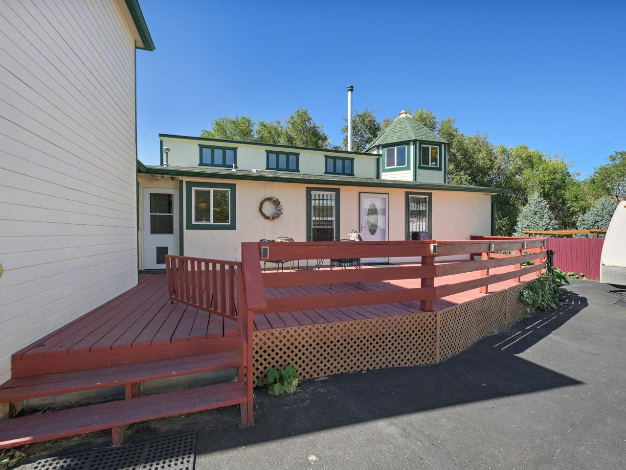 3694 F Road Palisade, CO 81526 - Photo 38 of 42 a view of a house with wooden deck
