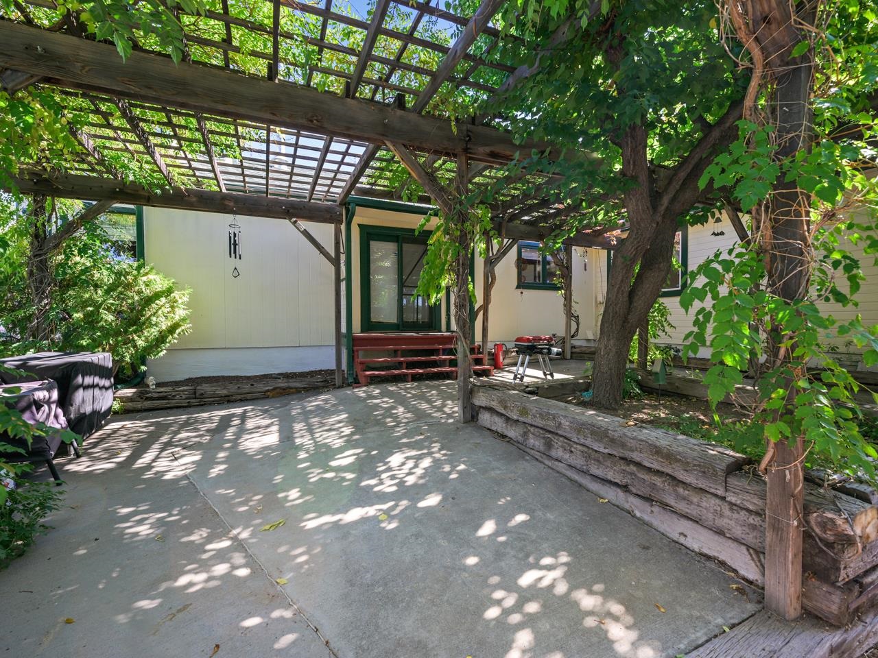 3694 F Road Palisade, CO 81526 - Photo 7 of 42 a front view of a house with garden