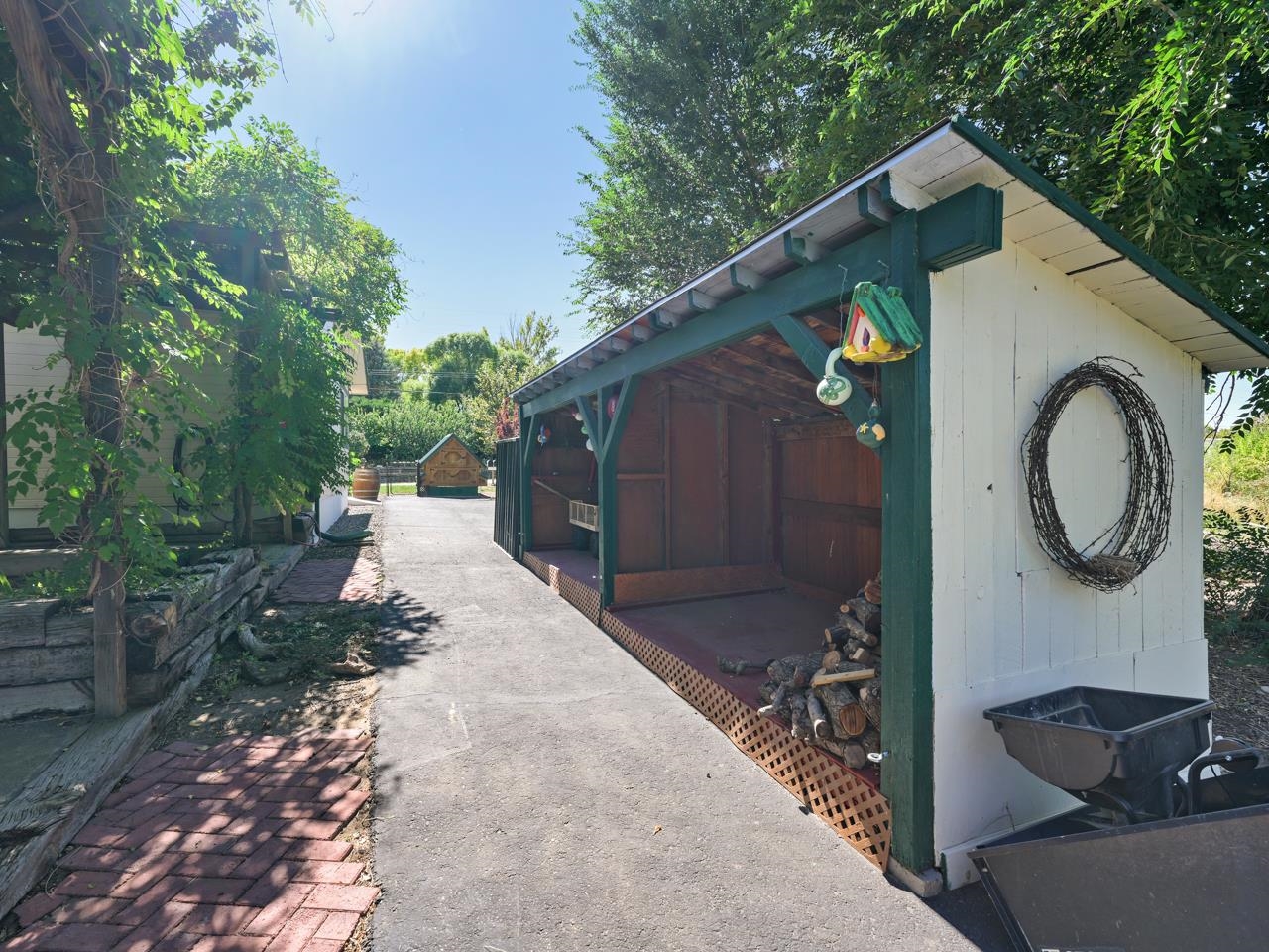 3694 F Road Palisade, CO 81526 - Photo 8 of 42 a backyard of a house with seating space and trees