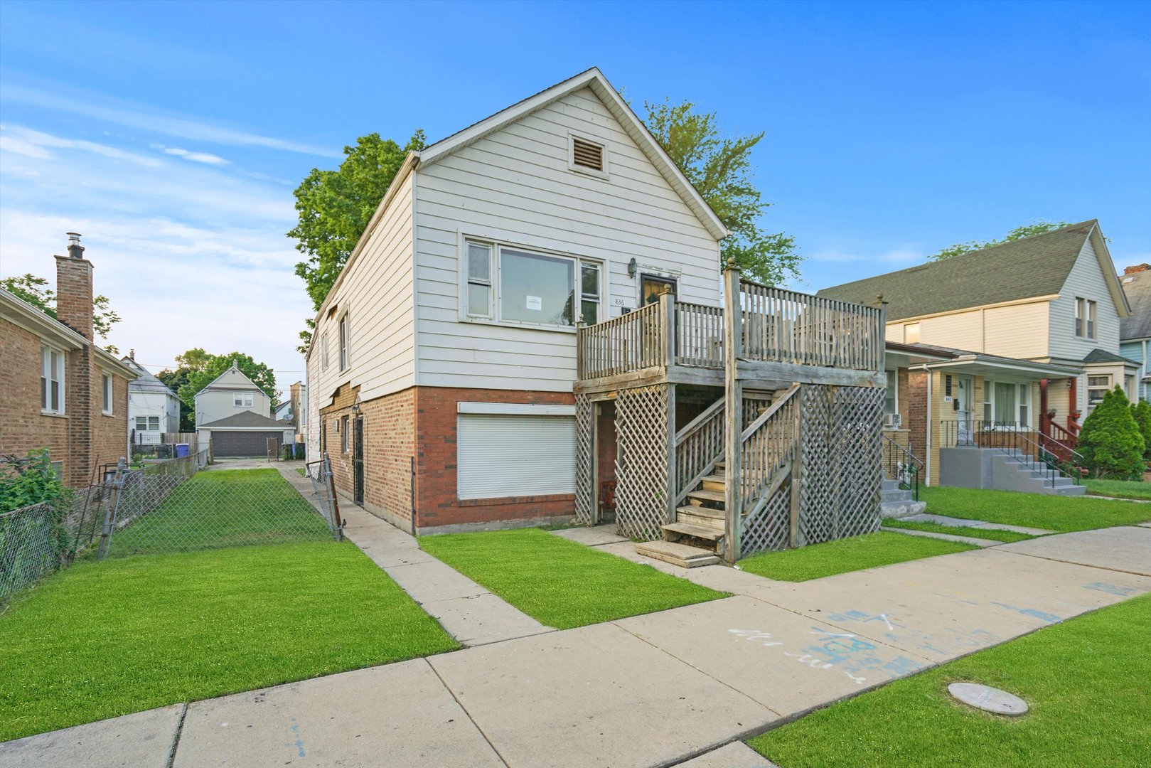 836 East 89th Street Chicago, IL 60619 - Photo 3 of 30 a view of a house with a yard