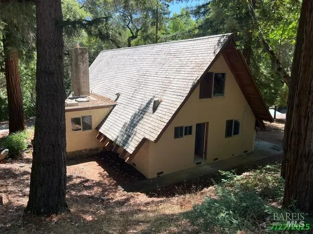 a aerial view of a house with a yard