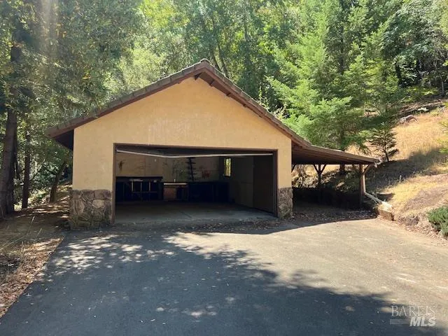 a view of house with outdoor space and car parked