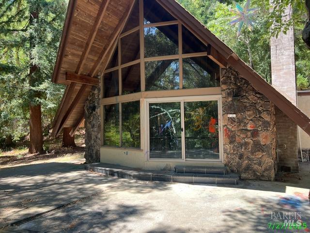 4593 Dry Creek Road Napa, CA 94558 - Photo 9 of 11 a view of a house with a window and a tree