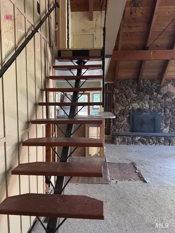 a view of a porch with chairs and a yard