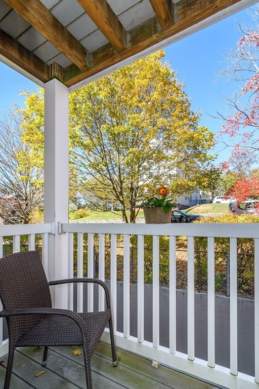 71 Edgeworth Street, Unit 21 Worcester, MA 01605 - Photo 12 of 13 a view of a chair and table in the balcony