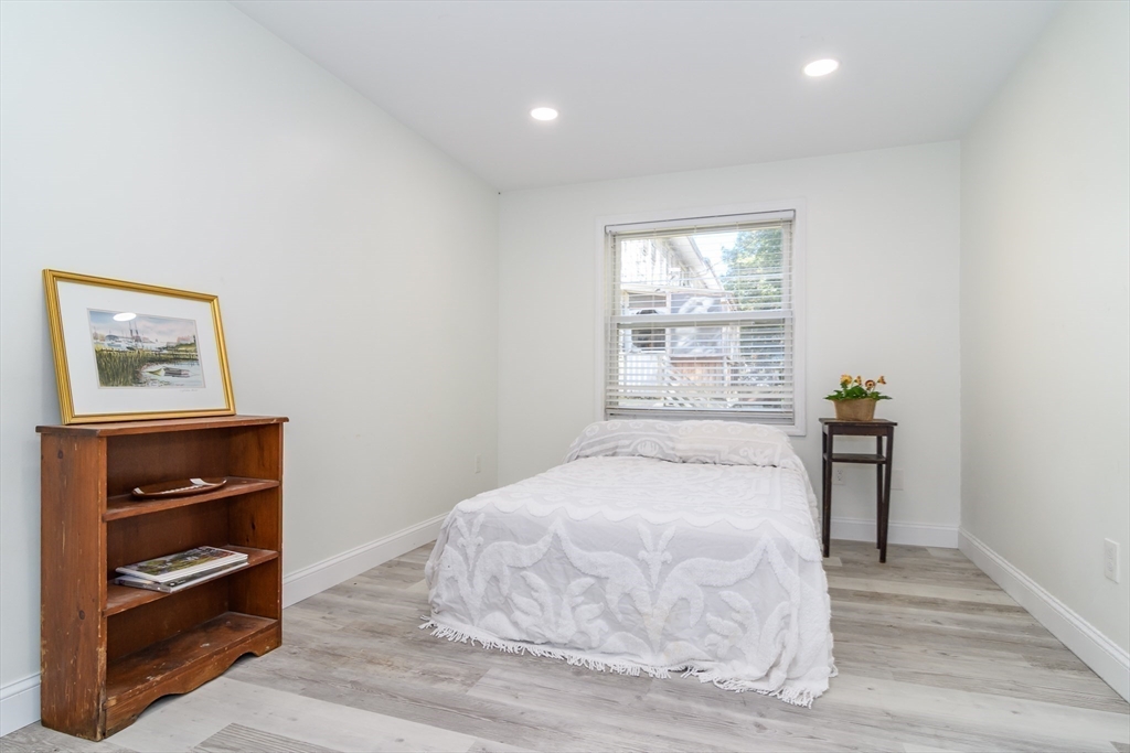 71 Edgeworth Street, Unit 21 Worcester, MA 01605 - Photo 7 of 13 a bedroom with a bed and a window