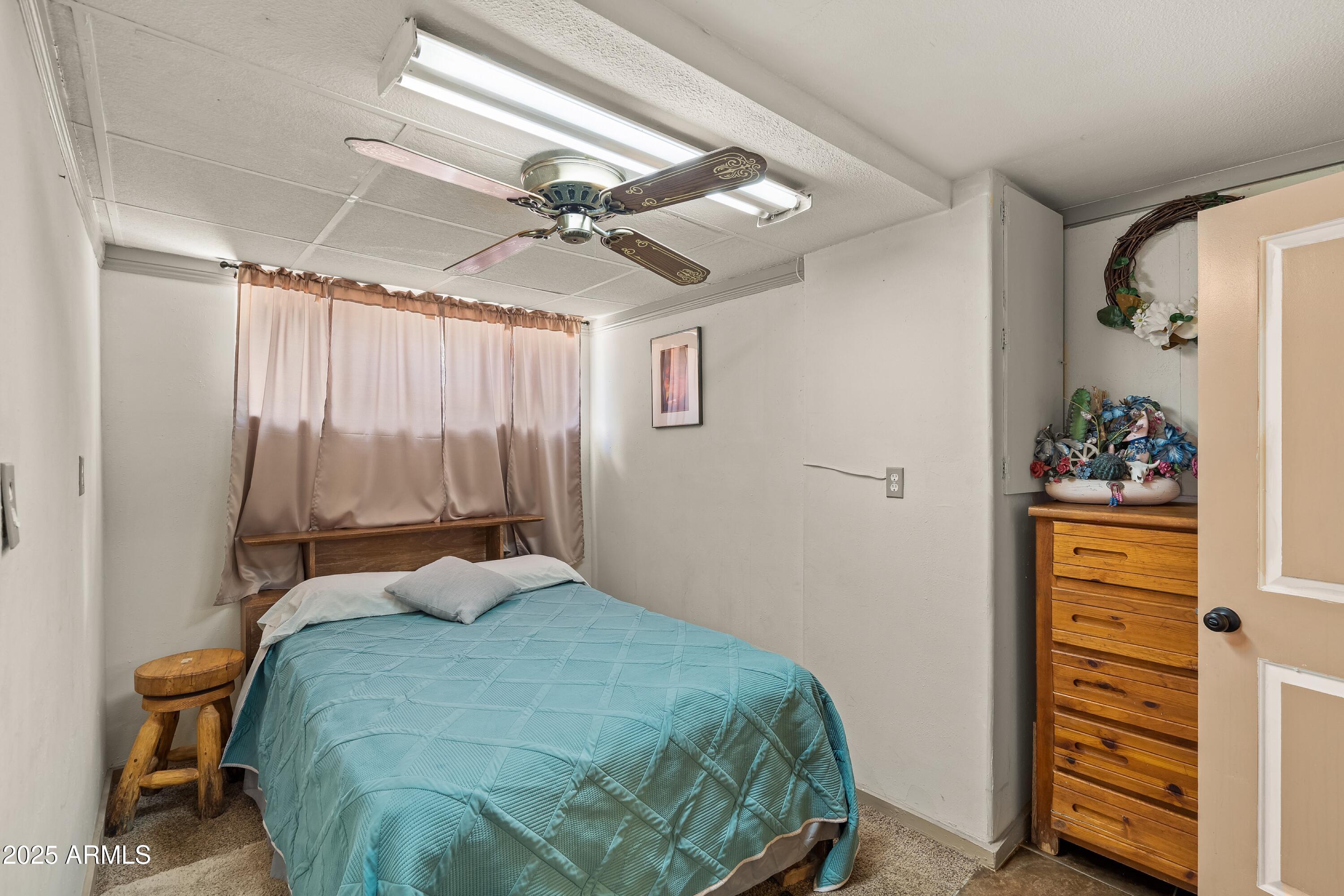 116 North 3rd Street Tombstone, AZ 85638 - Photo 28 of 64 a bedroom with a bed and a closet