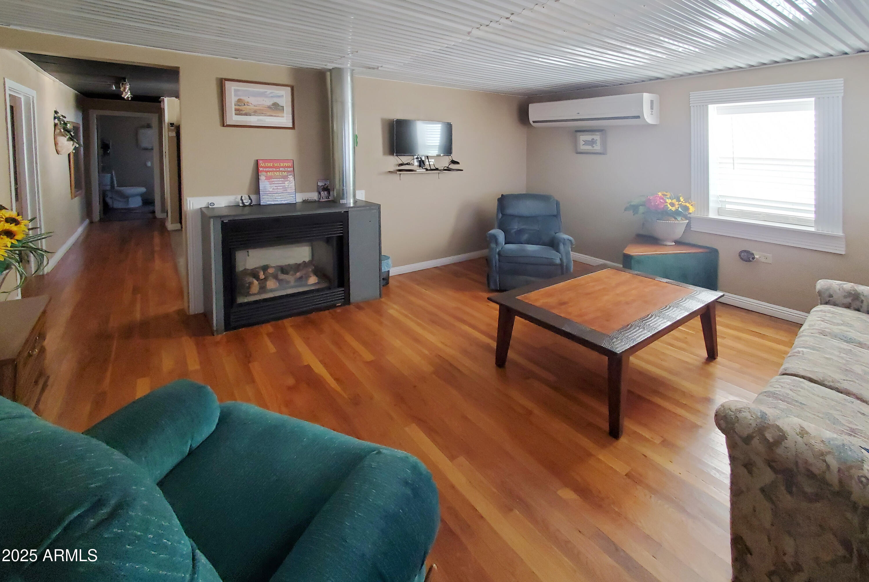 116 North 3rd Street Tombstone, AZ 85638 - Photo 35 of 64 a living room with furniture and a fireplace