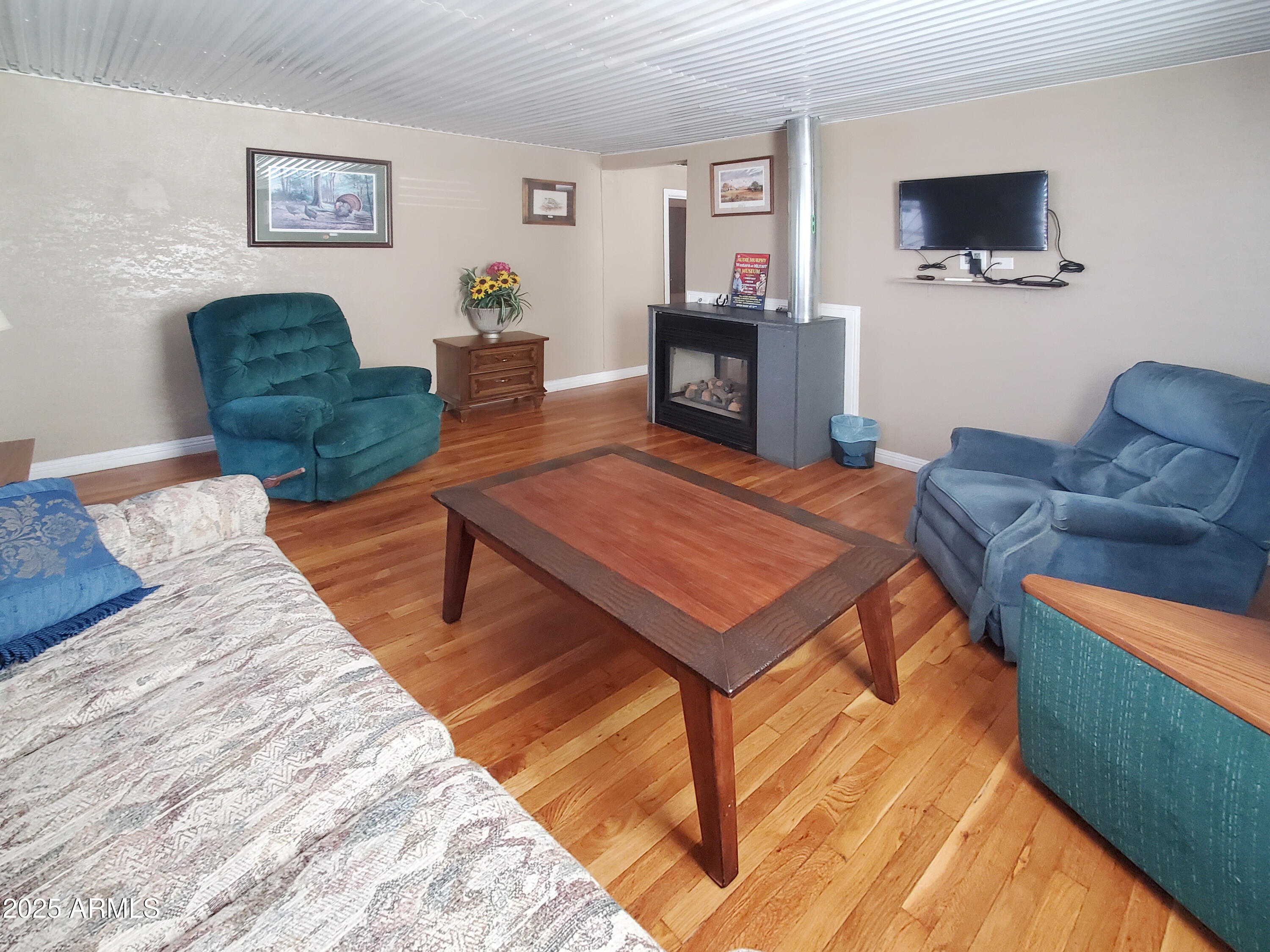 116 North 3rd Street Tombstone, AZ 85638 - Photo 36 of 64 a living room with furniture and a flat screen tv