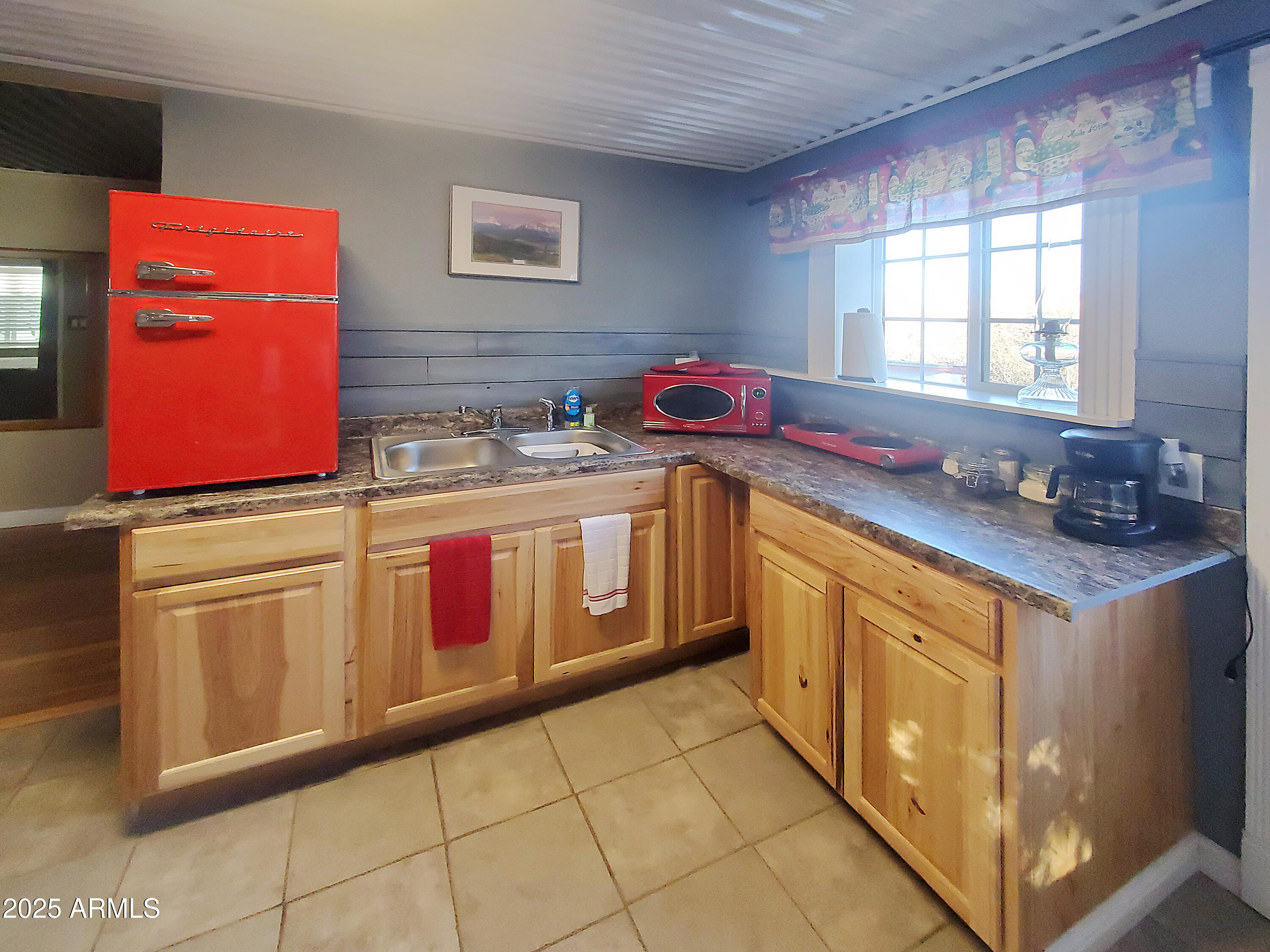 116 North 3rd Street Tombstone, AZ 85638 - Photo 39 of 64 a utility room with stainless steel appliances granite countertop a sink stove and cabinets