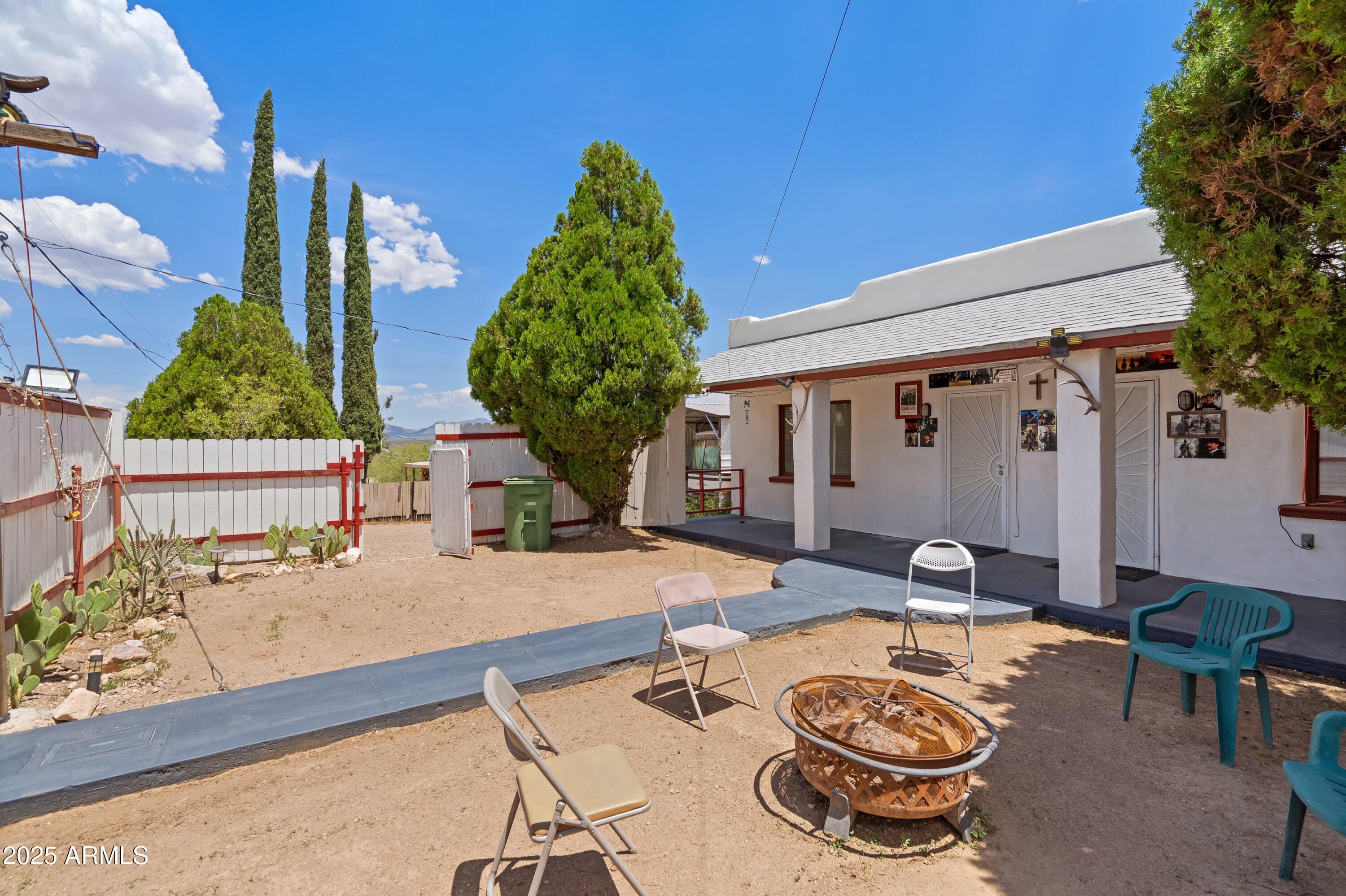116 North 3rd Street Tombstone, AZ 85638 - Photo 4 of 64 a swimming pool with outdoor seating and yard