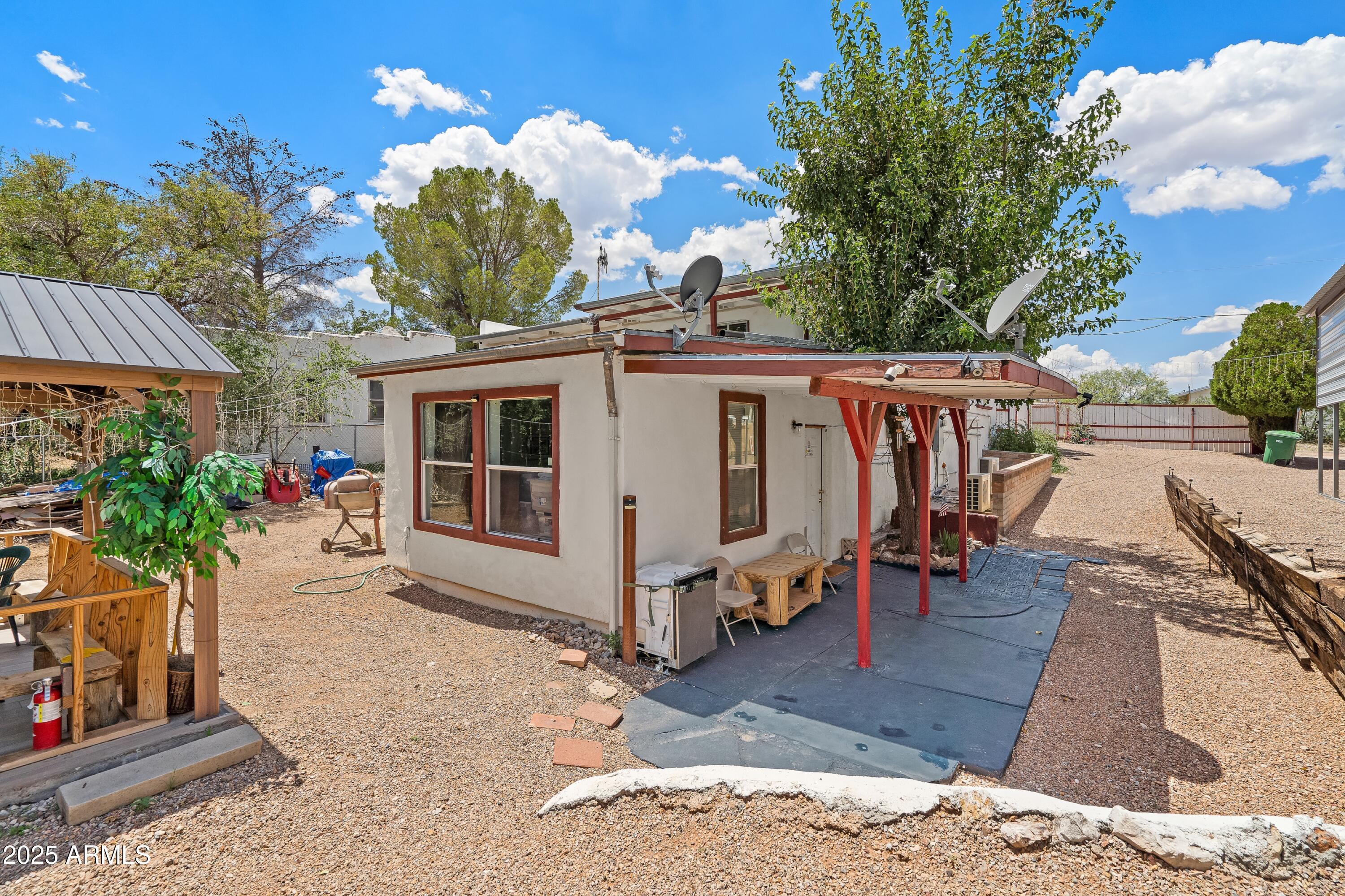 116 North 3rd Street Tombstone, AZ 85638 - Photo 46 of 64 a view of a house with backyard and sitting area