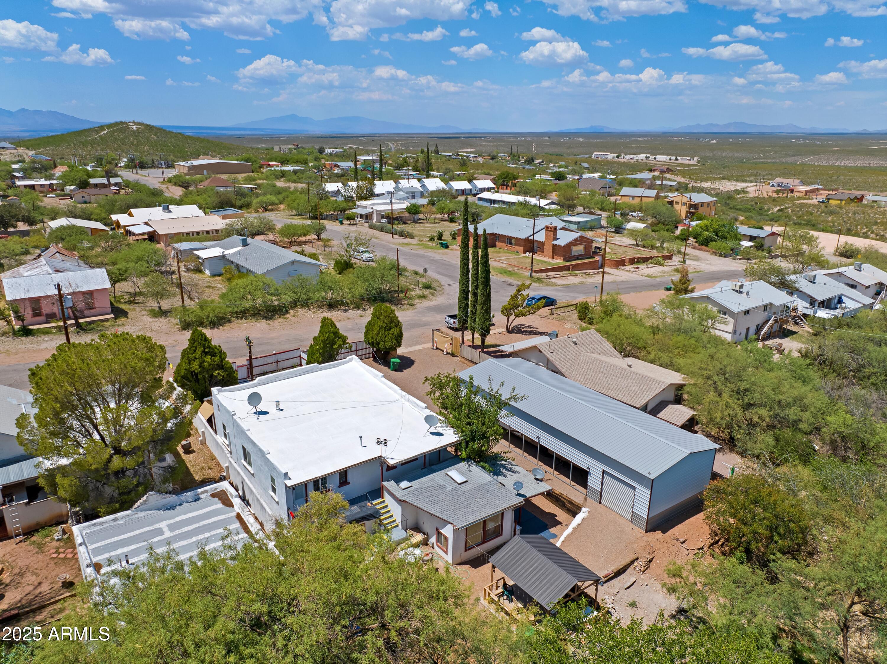 116 North 3rd Street Tombstone, AZ 85638 - Photo 59 of 64 an aerial view of residential houses with outdoor space and ocean view
