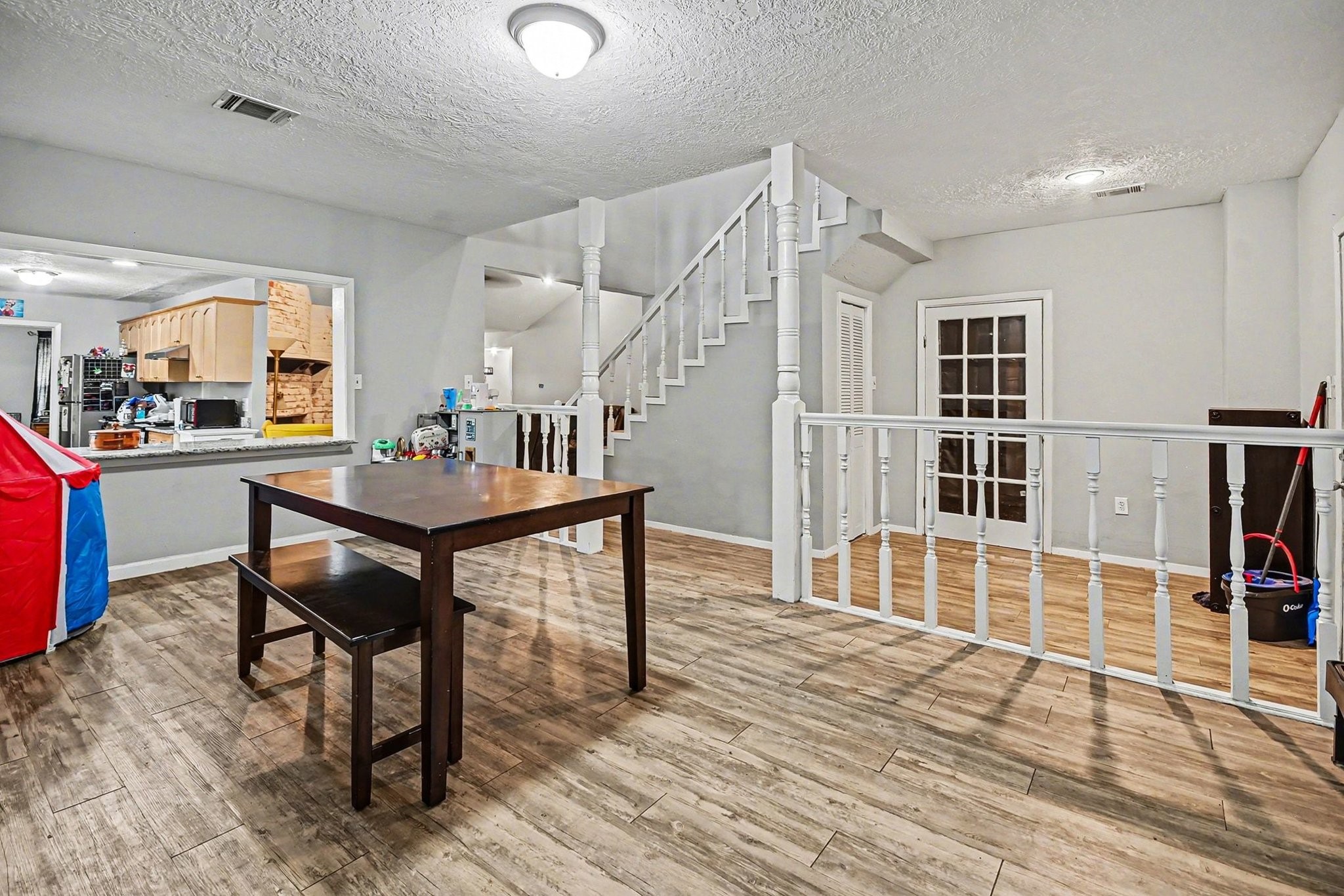 1339 Macclesby Lane Channelview, TX 77530 - Photo 13 of 21 a workspace with furniture and wooden floor