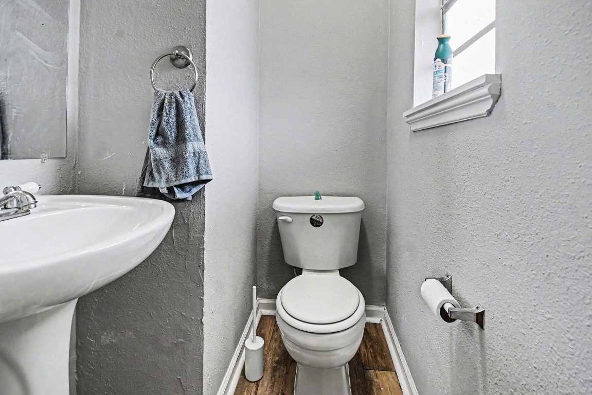 1339 Macclesby Lane Channelview, TX 77530 - Photo 14 of 20 a bathroom with a sink a toilet and a mirror