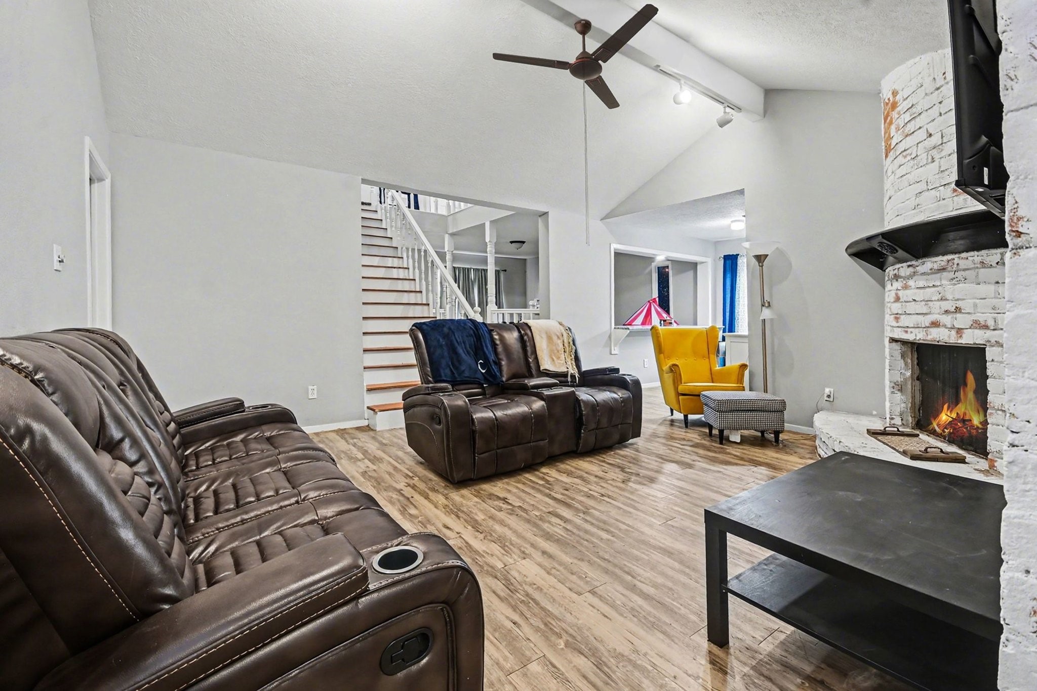 1339 Macclesby Lane Channelview, TX 77530 - Photo 8 of 21 a living room with furniture a fireplace and a flat screen tv