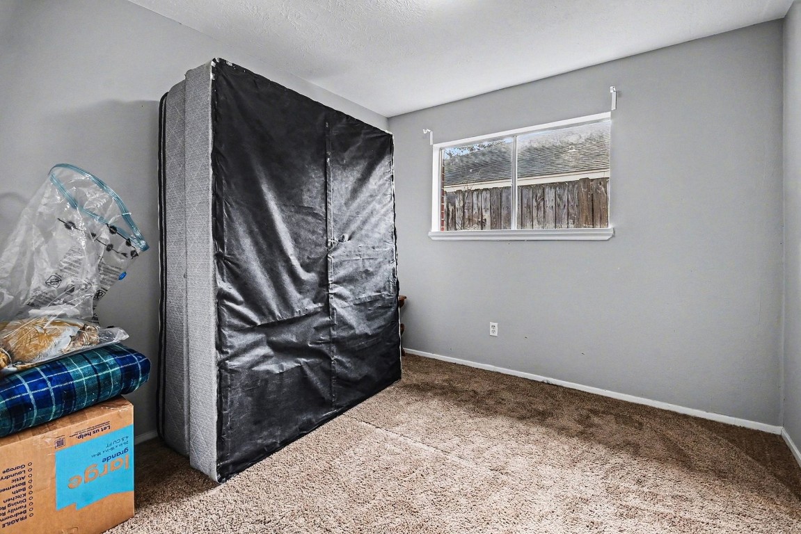 1339 Macclesby Lane Channelview, TX 77530 - Photo 8 of 20 a view of a livingroom with wooden floor and a window