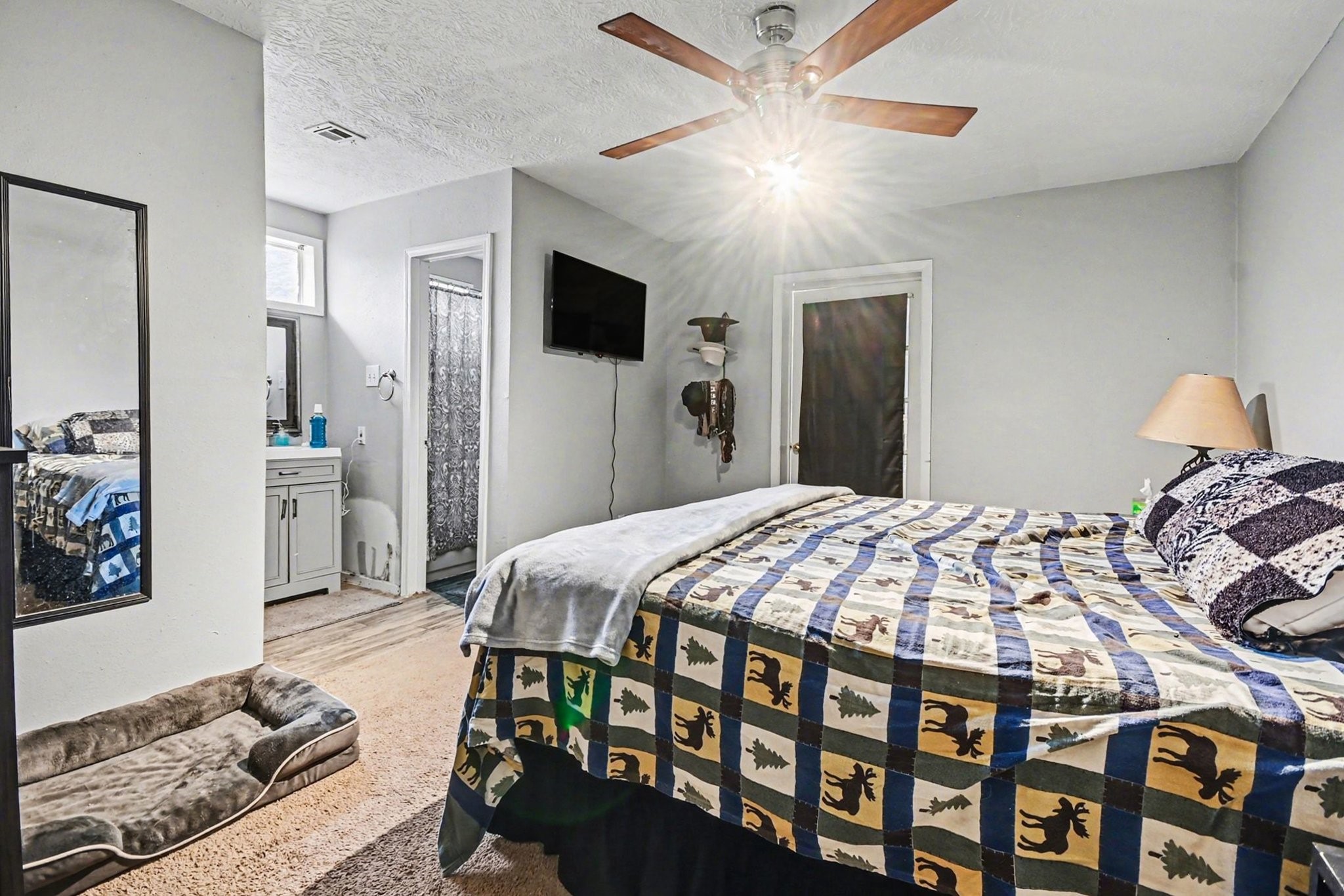 1339 Macclesby Lane Channelview, TX 77530 - Photo 9 of 21 a bedroom with a bed and a tv